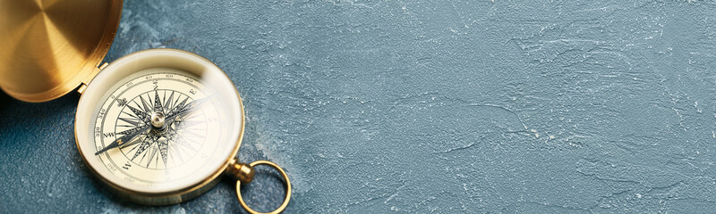 Vintage compass on grey background with space for text © Pixel-Shot