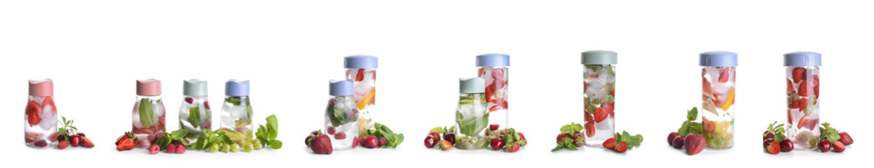 Bottles of mint infused water with berries and citrus fruits on white background