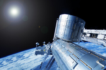 Iss over the planet Earth. Elements of this image furnished by NASA - Powered by Adobe