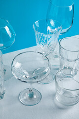 Different empty glasses on table