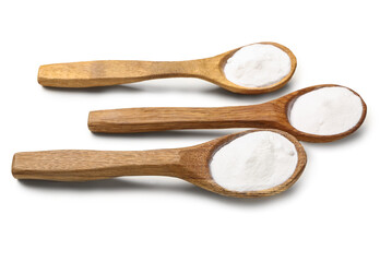 Spoons of baking soda on white background