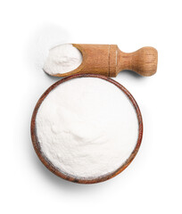 Bowl of baking soda and scoop on white background