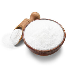 Bowl of baking soda and scoop on white background