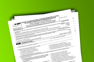 Fototapeta premium Form W-8IMY documentation published IRS USA 11.18.2021. American tax document on colored