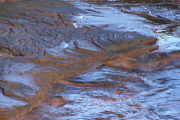 Sky reflections on water along coastline, Cavendish, Prince Edward Island, Canada