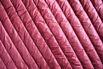 Quilting texture of polyester fabric in burgundy color