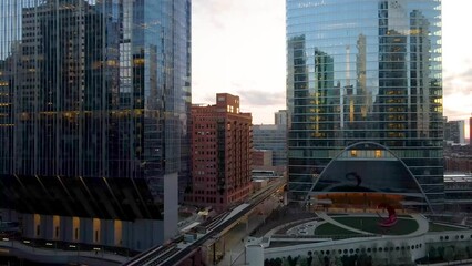 Chicago, IL USA- April 28th 2022: aerial drone shot of downtown Chicago by the river during sunset.  the beautiful skyscrapers look futuristic along the lake and river 