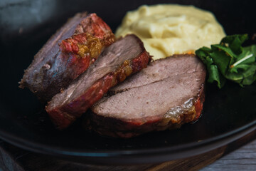 roast beef platter with mashed potatoes and salad