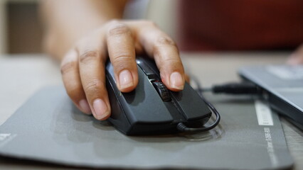 person typing on a computer Mouse, keyboard.
