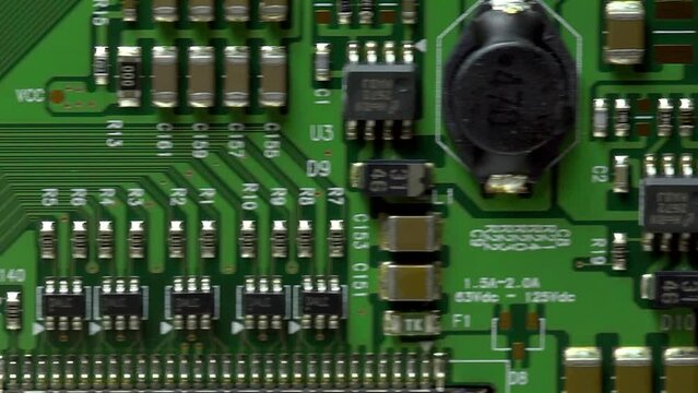 fly over electronic circuit board, green, lots of components