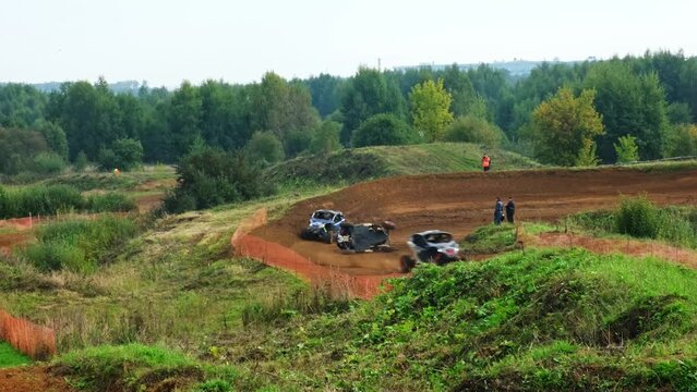 Race vehicles buggies go around the accident at the race