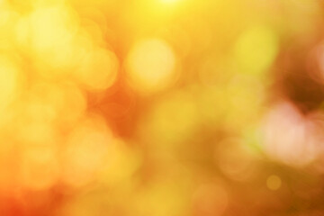 Fototapeta premium Abstract blurry orange color for background, Blur festival lights outdoor celebration and white bokeh focus texture decorative design elegant for winner.