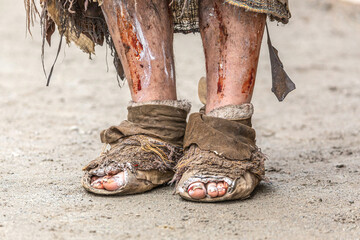 Close-up details of an authentic cosplay costume of a medieval leprosy invalid at a festival