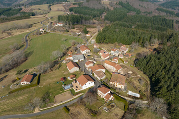 Aerial view of residential houses in green suburban rural area