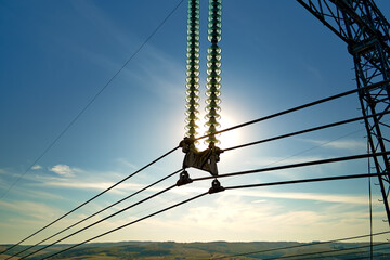 High voltage insulation string on steel pillar with electric power lines for safe delivering of...