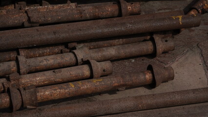 Stack of iron pipes at construction site