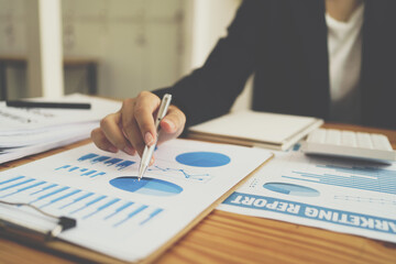 Business men looking at charts, spreadsheets, graph financial development, bank accounts, statistics, economy, data analysis, investment analysis, stock exchange