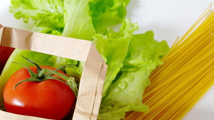 Food delivery - fresh vegetables, fruit, pasta in a paper bag, zero waste concept, online shopping,...