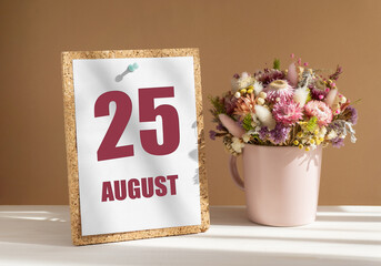 august 25. 25th day of month, calendar date.Bouquet of dead wood in pink mug on desktop.Cork board with calendar sheet on white-beige background. Concept of day of year, time planner, summer month
