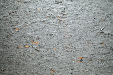 An image of a real gray painted wooden wall background with chips, scrapes, and other aged grungy...