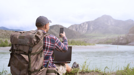 Freelancer using digital devices in the countryside