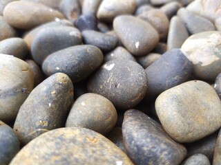 Fototapeta na wymiar stones on the beach sunny morning