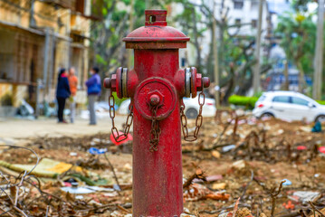 Close-up of fire hydrant in the ruins of an abandoned residential building