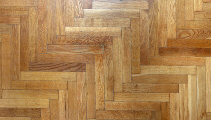 Herringbone pattern parquet wood floor texture. Wooden oak flooring background, overhead