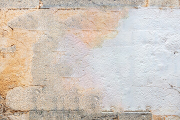 Old gray color stone wall texture background. Aged industrial construction, front close up view