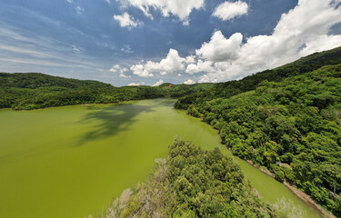 Panorama landscape nature lake or pond Aerial view drone shot of scenery mountain green tropical rainforest and blue sky in phuket thailand