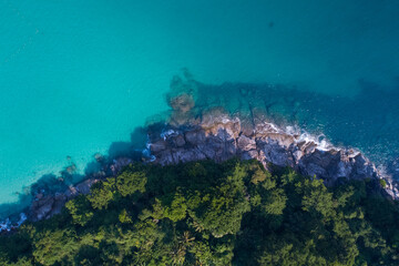 Amazing top view seashore Aerial view of Tropical beach sea in the beautiful Phuket island. Beautiful ocean beach at Phuket Thailand