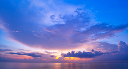 Naklejka na ściany i meble Sunset or sunrise sky clouds over sea sunlight in Phuket Thailand Amazing nature landscape seascape background