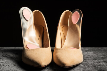 Soft orthopedic silicone insoles prepared for women's dress shoes with high heels.