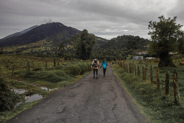 Obraz premium couple of hikers walking in the Turrialba Volcano National Park in Costa Rica