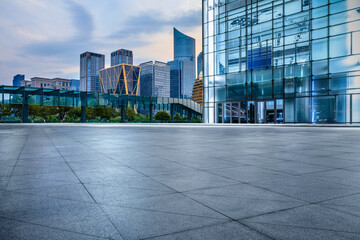 Fototapeta na wymiar Empty square floor and city skyline with modern commercial buildings in Hangzhou, China.