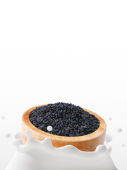 Black Sesame, Soy Milk, The movement of sesame grains in wooden bowl falling into dairy splashed, Isolated on white background, Ketogenic diet and Healthy drinks lactose free for Health care concept.