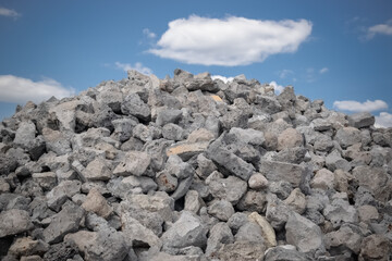 Fototapeta na wymiar Close-ups of crushed stone for construction and road works against the blue sky