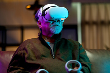 exicet asian senior old man white beard enjoy virtual augmented reality metaverse esport online...