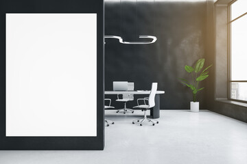 Modern dark concrete office interior with empty white mock up poster on wall, furniture, window with city view, equipment and decorative plant. 3D Rendering.