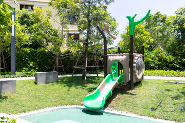 Outdoor playground kids play in school or kindergarten, active kids on colorful slides and swings, healthy summer activities for little boys climbing outdoor playground.
