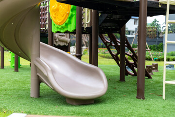 Outdoor playground kids play in school or kindergarten, active kids on colorful slides and swings, healthy summer activities for little boys climbing outdoor playground.