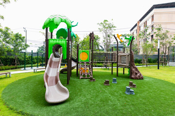 Outdoor playground kids play in school or kindergarten, active kids on colorful slides and swings,...