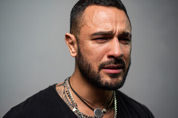 Emotional cry upset guy. Pensive man feeling stress. Lonely frustration man. Lonely single man. Hispanic guy feeling lonely and melancholy. Man cry with tears.