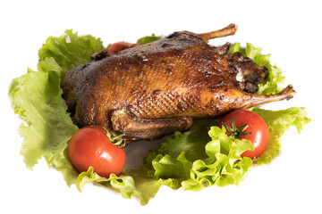 Duck baked until golden brown lies on a light background
