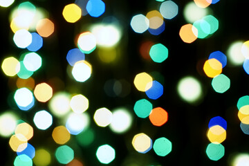 Fototapeta premium multicolored burning lights in a blur on a black background background screensaver