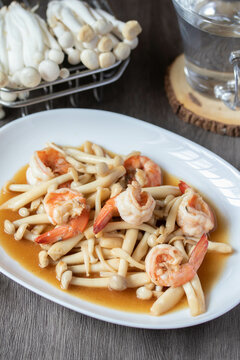 Sauteed Shimeji Mushrooms with Prawns in a White Plate