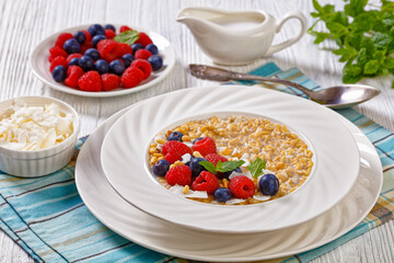 hulled whole grain oat porridge with berries