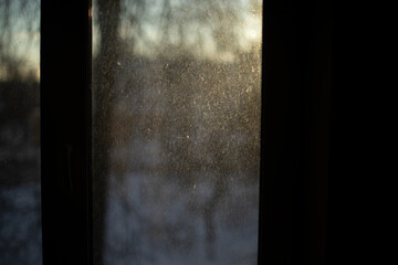 Curtain on window in morning. Dawn outside window.