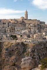 Obraz premium Panoramic view of Sassi di Matera a historic district in the city of Matera, well-known for their ancient cave dwellings from the Belvedere di Murgia Timone, Basilicata, Italy
