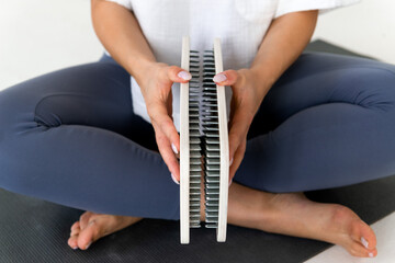 person holding sadhu boards for nails standing practice, cropped picrure